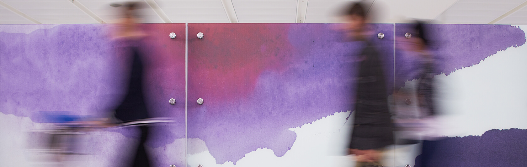 Penny Coss' glazed wall installation at the T1 International arrivals area