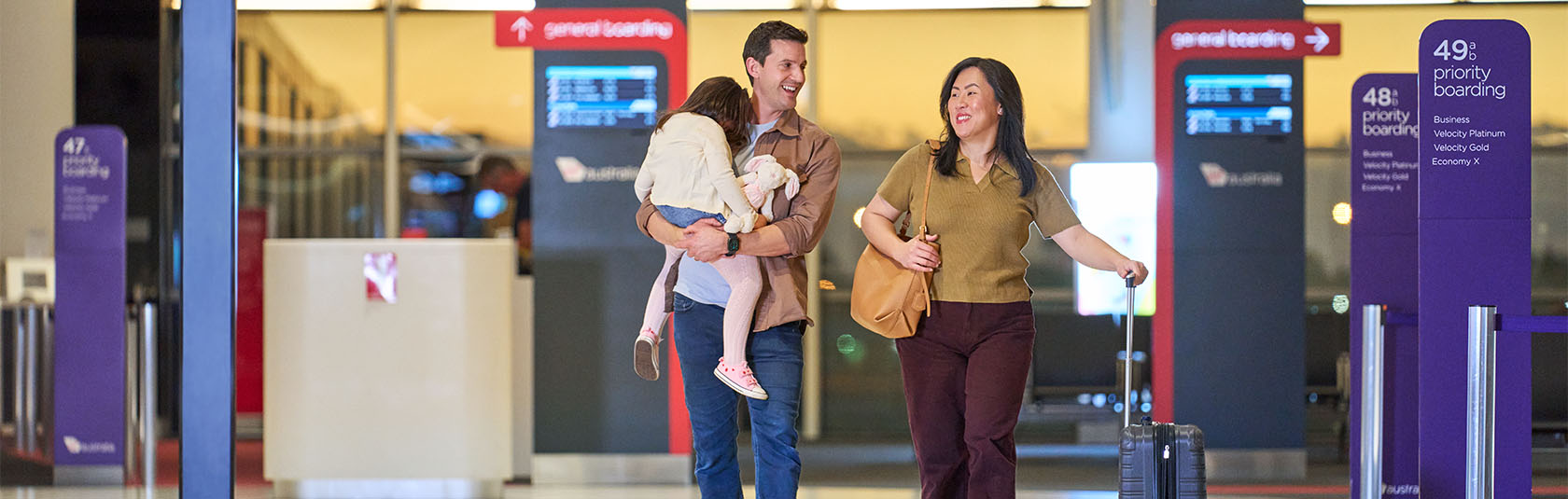 Picture of a couple with a child in the airport